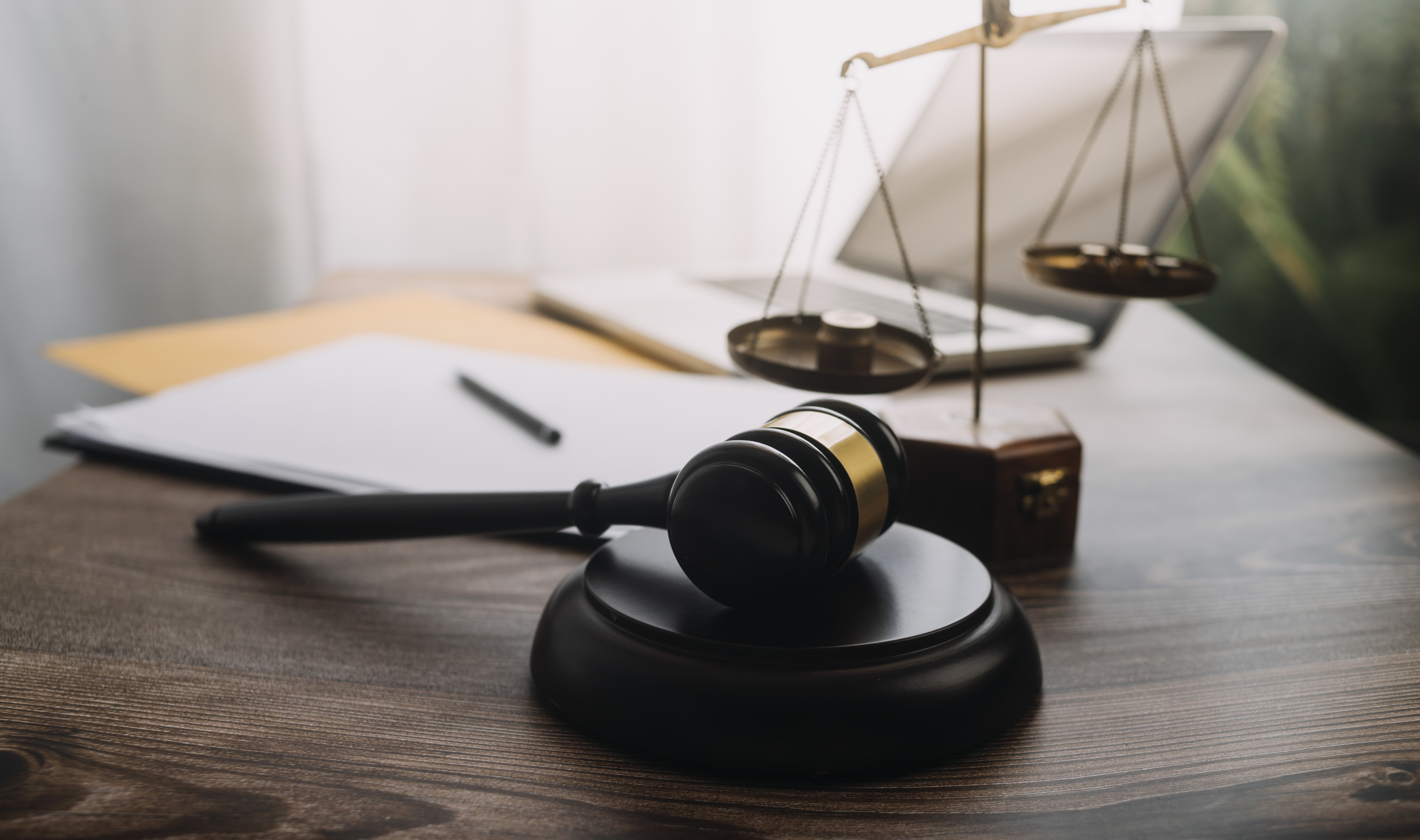 vecteezy_business-and-lawyers-discussing-contract-papers-with-brass_11330714_379.jpg